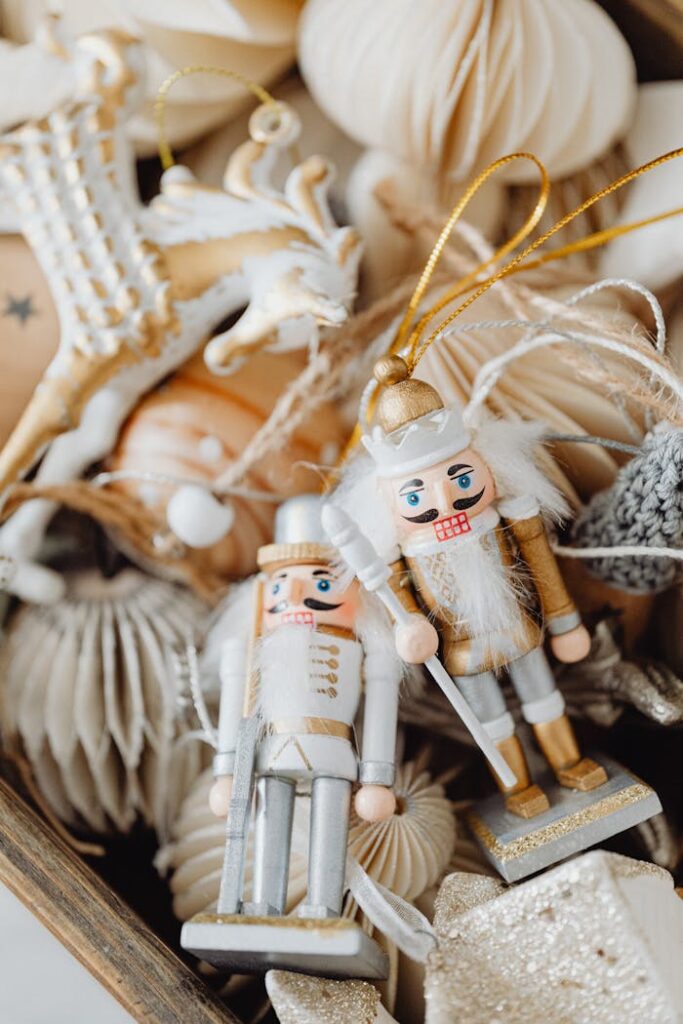 A detailed close-up of elegant nutcracker figurines and holiday ornaments in soft tones.